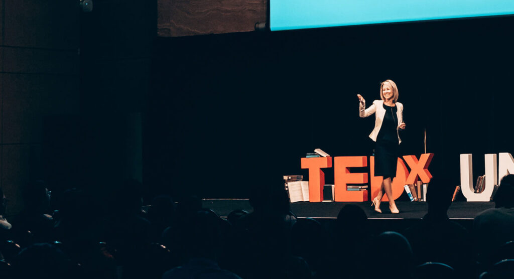 Dr. Alexandra Walker speaking at a TedX event.
